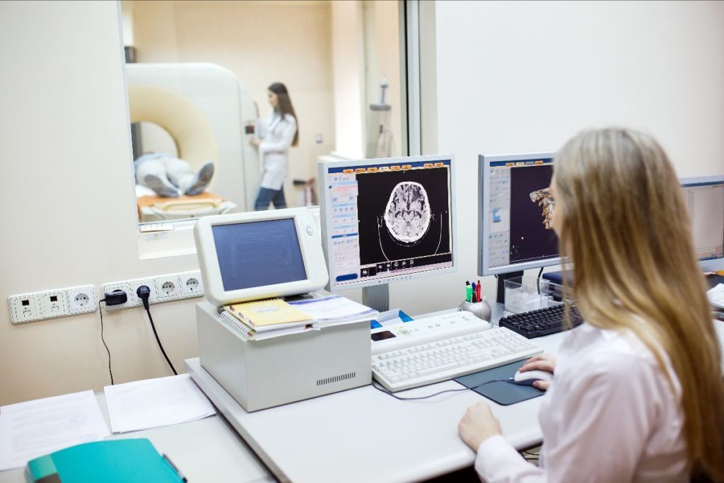 two scientists conducting MRI test