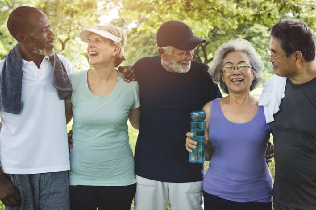 Five people in exercise clothes smiling