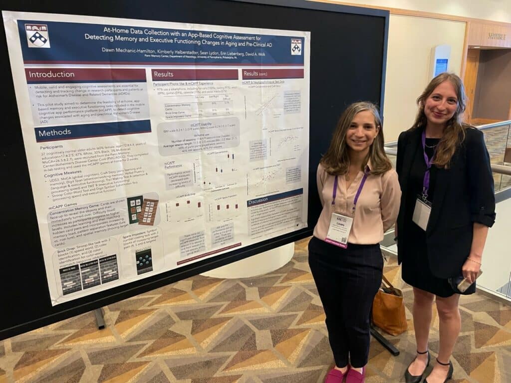 Dawn Mechanic-Hamilton (left) and Kimberly Halberstadter (right) presenting their research poster at AAIC