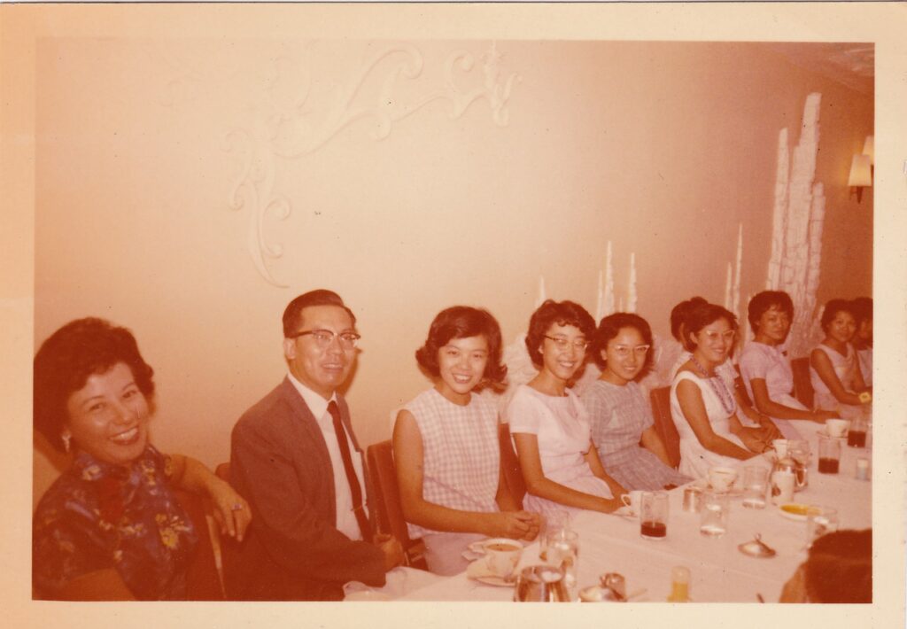 Dr. Lee in high school with her teachers and classmates